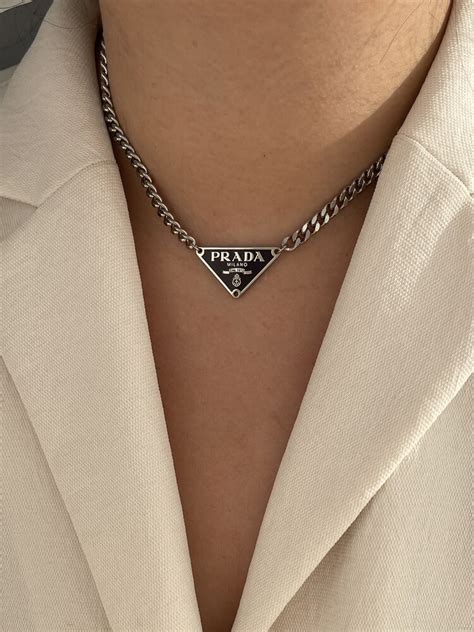 prada necklas|Prada symbol necklace.